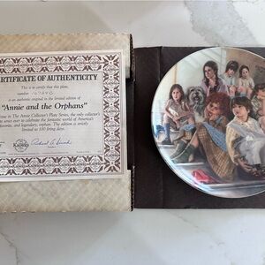 The Edwin M. Knowles "Annie and the Orphans" collector plate.
